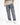 Casual gray cargo jeans with multiple pockets, styled with a beige gradient shirt and white sneakers.
