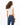 Back view of the Luna white ribbed cropped tank top and blue skinny jeans, highlighting the athletic body-hugging fit.