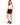 Woman in black drawstring sweat shorts and a white tank, three-quarter view