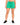 Green drawstring sweat shorts from the waist down with black sneakers
