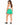 Back view of green sweat shorts worn with a white tank and black sneakers