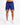 Navy blue shorts with a colorful geometric pattern at the hem, paired with white sneakers.