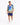 A man wearing a colorful short-sleeve shirt with a vibrant graphic design and matching shorts, paired with white snea...