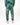 Casual green joggers featuring intricate coral-inspired designs along the sides, paired with white sneakers.