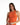Model wearing the Mara orange ribbed crop tank, a sleeveless summer top with a front zip and high neckline.