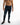 Marco dark blue distressed denim jeans with ripped knees on model, cropped view highlighting fit and wash.