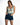 A model poses in a tie-dye tank top and high-waisted denim shorts, showcasing a casual summer look.