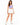 A woman stands confidently in a lavender crop top and white high-waisted shorts, paired with white sneakers.