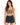 A woman with long, wavy hair wears a fitted brown crop top and high-waisted black denim shorts.
