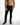 Mason Slim Straight Black Jeans with subtle distressing in a streetwear style on a male model.