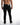Rear view of Mason men's black slim straight streetwear jeans by Carbon with signature waist patch and back pockets.