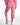 A person wearing pink joggers with elastic cuffs and white sneakers, showcasing a casual and comfortable style.