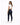 A woman in a fitted white crop top and dark skinny jeans poses from the back, showcasing a casual style.