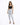 A model poses in light-wash ripped jeans paired with a black crop top and strappy heels against a white background.