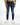 Fitted blue denim jeans with distressed details and a zippered section at the knee, paired with white sneakers.