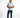Man in white Mind Power graphic streetwear t-shirt and blue jeans against a white background.