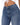 Close-up of a person wearing high-waisted blue denim jeans with a button closure and subtle stitching details.