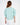 Back view of the More and Less teal knit sweatshirt featuring a cropped fit and ribbed crewneck on a model.