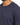 Close-up of a navy blue short-sleeve top featuring a classic crew neckline and soft fabric texture.