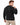 A man with tousled hair wears a textured black sweatshirt, showcasing a cozy, relaxed fit from the back.