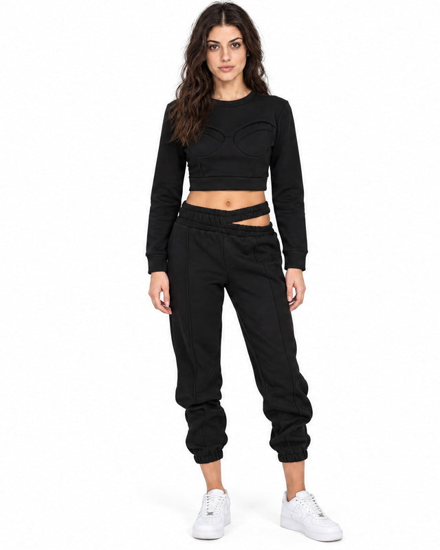 Eyes Top Set in Black – full-length front view of cropped bustier-seam top and cutout-waist joggers