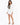 Nina Skirt Set in White – full-length front view of cropped one-button blazer and asymmetric mini skirt