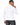 Tyson Sweater in White – back view of the turtleneck with ribbed cuffs and hem, worn with black jeans