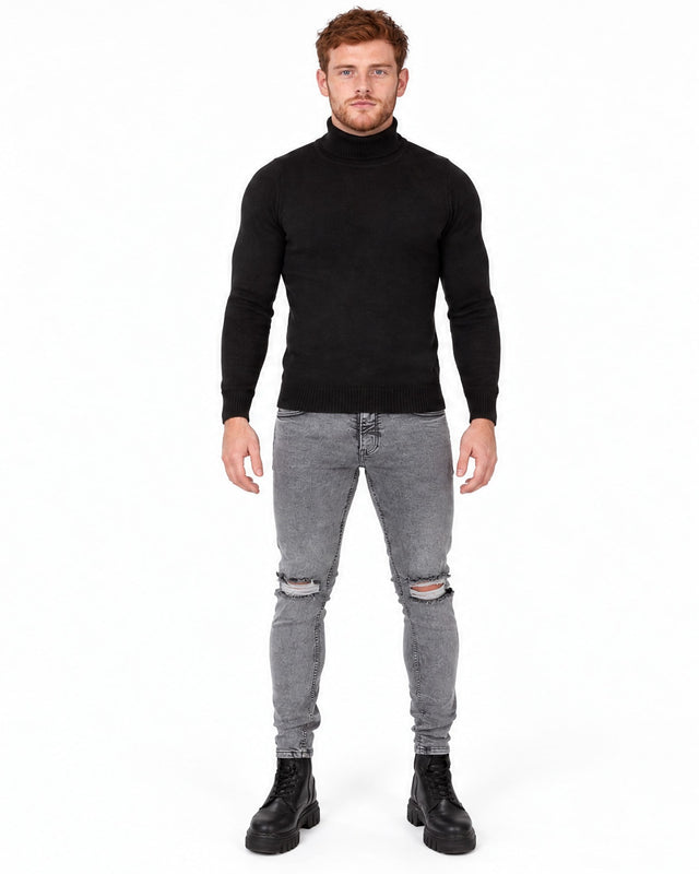 Romeo Turtleneck Sweater in Black – full-length front view on a model with grey ripped-knee jeans