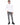 Romeo Turtleneck Sweater in White – full-length front view on a model with ribbed cuffs and hem, gray ripped jeans