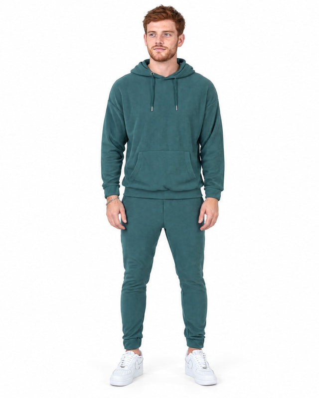 Gordon Pants Set in Teal – full-length front view of ribbed hoodie and cuffed joggers on a model