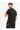 A man with short hair wearing a black t-shirt and cargo pants, looking back over his shoulder.