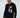 Man wearing black Never Give Up graphic long-sleeve streetwear t-shirt with grey geometric design on front.