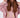 Model wearing the salmon pink Remi Jacket Set featuring a hooded zip-up, cut-out bodysuit, and matching joggers.
