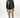 Man in a Peter Puffer Vest: black streetwear puffer vest with a leather-like finish paired with tan cargo pants.