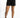 Kinslee high-waisted distressed black washed denim shorts with a button fly and raw hem details on a model.