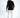 Back view of the black Keep On Moving graphic long sleeve streetwear shirt on a male model with white jeans.