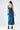 Back view of the London Dress, a shimmering teal blue satin midi dress with a square neckline and thick straps.