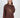 Model wearing a brown NY graphic sweatshirt with ribbed crew neck and oversized streetwear fit.