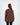 Back view of a woman wearing the NY brown oversized sweatshirt in a ribbed streetwear style.
