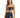 A model poses in a dark patterned two-piece outfit featuring a knotted crop top and a matching wrap skirt.
