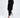 A model wearing black jogger pants paired with white sneakers and elastic cuffs.