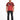 A man stands wearing a red graphic t-shirt with a black abstract design and white text on the front.