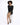 A model poses in a fitted black sequined dress with long sleeves, paired with black high heels.