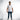 A man stands confidently wearing a white short-sleeve shirt with textured lettering, paired with blue jeans and styli...