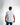 A man wearing a fitted white short-sleeve shirt stands with his back to the camera, showcasing a minimalist design.