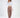 Model wearing the Adriana White Off-Shoulder Long Sleeve Crop Top with high-waisted brown trousers and black heels.