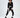 Model in Finaley black velvet romper with white belt, zipper details, and white cuffs for a streetwear OOTD look.