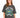 A woman models a relaxed-fit, dark gray t-shirt featuring a colorful graphic design with "New York" and decorative el...