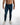 Finn Blue Denim Jeans by Carbon with light wash, side leg branding, and white sneakers streetwear style.