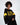 ALPES Black Ribbed Crop Top with yellow stripes and Snow Region graphic. Modern streetwear aesthetic for women.